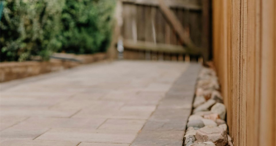 Sandstone paving patio and garden path by Mighty Contractors